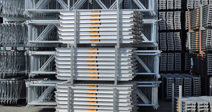 MonZon scaffolding equipment in storage MonZon scaffolding frames and platforms stacked in storage