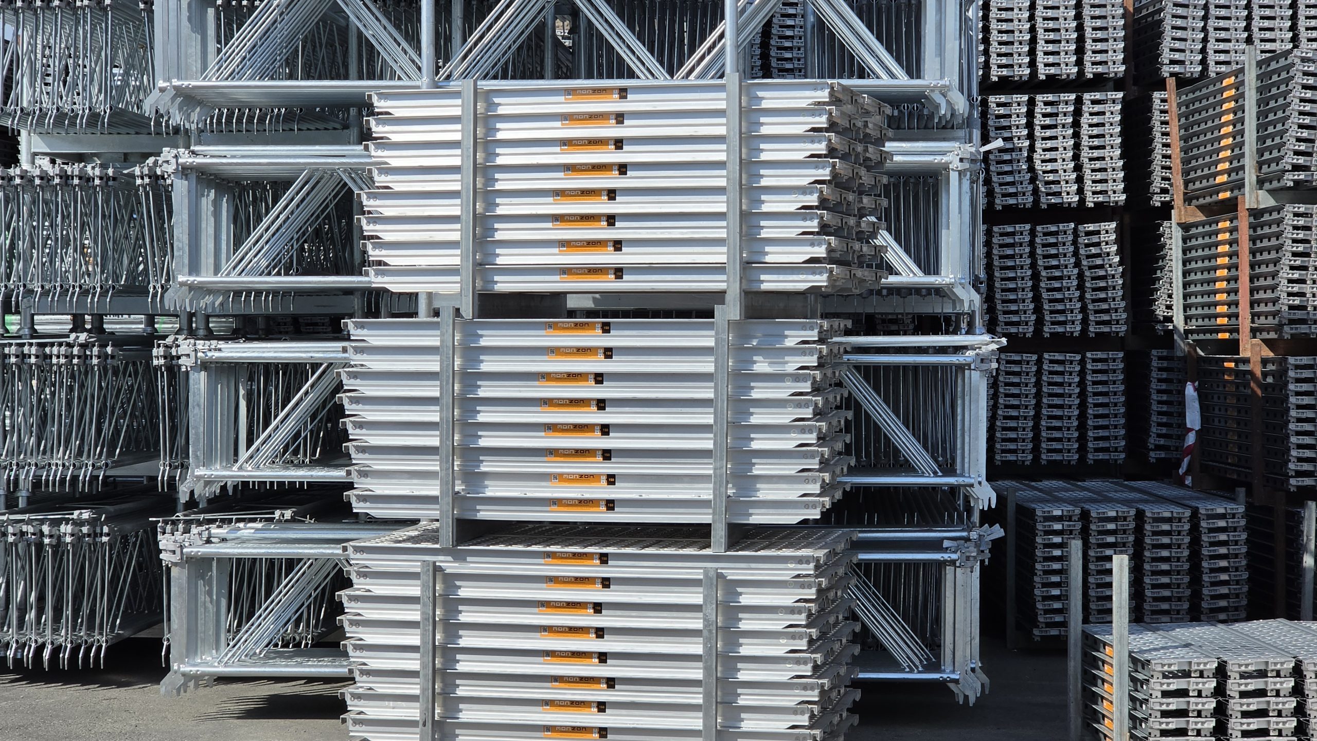 MonZon scaffolding frames and platforms stacked in storage